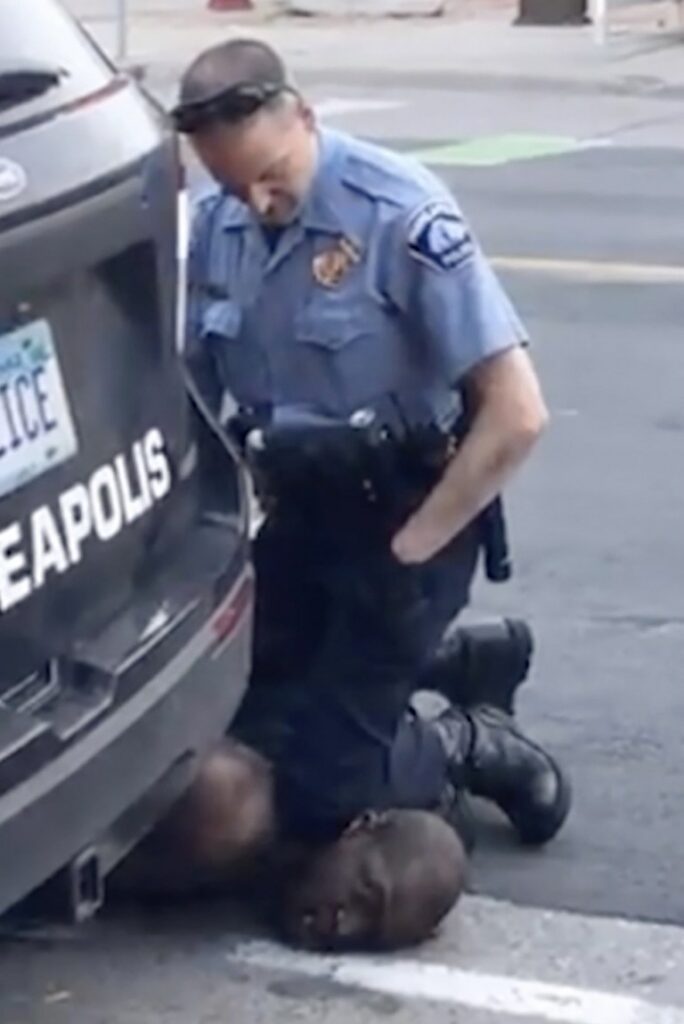 A white Minneapolis officer kneels on the neck of a handcuffed George Floyd as he pleaded ‘I can’t breathe’

